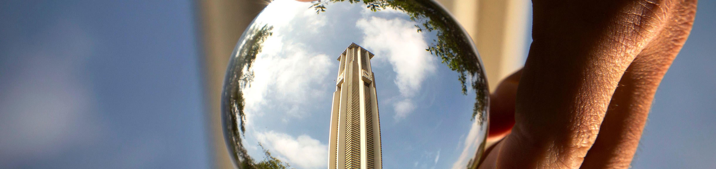 Belltower upside down, upside right through lens ball