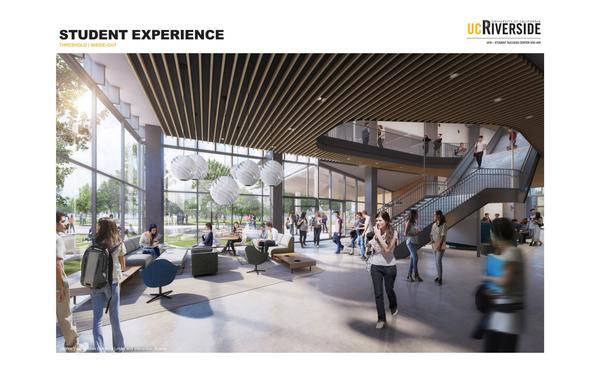 Rendering of Student Success Center Interior - Lobby filled with students studying and passing through to class, large staircase, modern furniture, and glass window walls